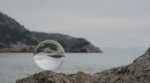 Crystal ball on sea Stock Footage 63685339