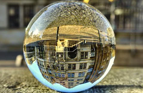 Crystal ball with upside-down historical buildings in the old town Ilustración de archivo