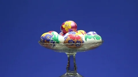 A crystal basket with Easter eggs hand-painted rotates around its axis Видео 73907279