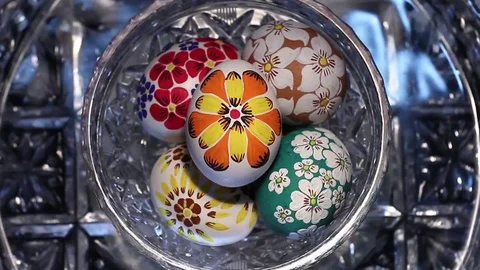A crystal basket with Easter eggs hand-painted rotates around its axis Stock Footage 74305181