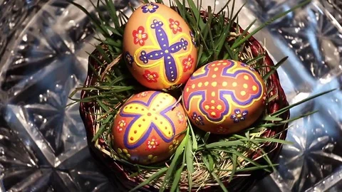A crystal basket with Easter eggs hand-painted rotates around its axis Stock Footage 74305268