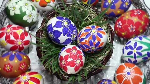 A crystal basket with Easter eggs hand-painted rotates around its axis Stock Footage 74305361