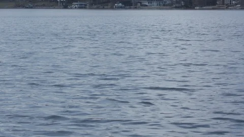 Crystal blue lake with rolling waves in slow motion. Stock Footage 88684625