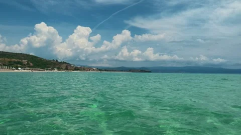 Crystal blue waves gently lap the shore. Trani Ammouda, Greece Stock Footage 339618298