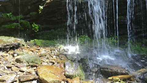 Crystal clean small waterfall close up shot in Transylvania Stock Footage 115394704