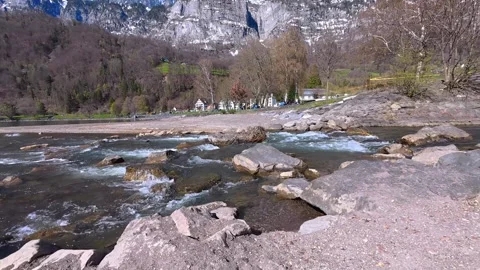Crystal Clear Alpine River Flowing Through Mountain Valley, Switzerland 4K Stock Footage 340900031
