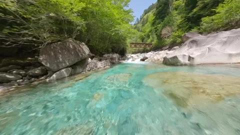Crystal Clear Atera River with Emerald Blue Water in Nagano, Japan by FPV Drone Video stock 332162416