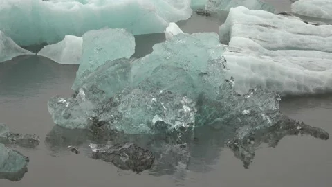 Crystal clear iceberg floating in ocean 1 Stock Footage 136613803