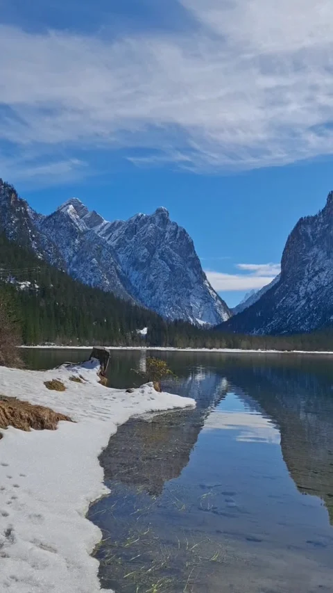 Crystal clear lake with mountain reflections in the Italian Alps, peaceful natur Video stock 328883136