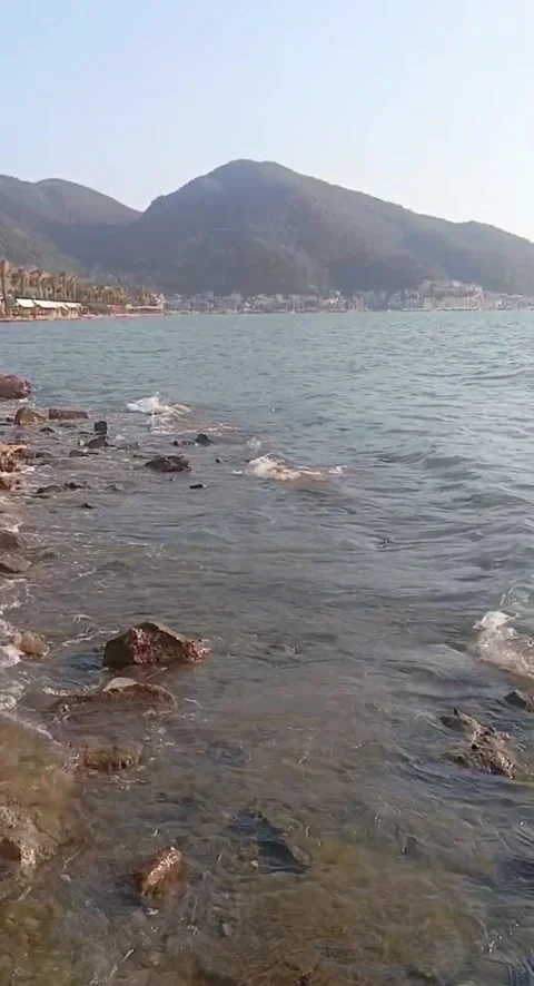 Crystal Clear Mediterranean Waves on a Rocky Shore 스톡 동영상 339799140