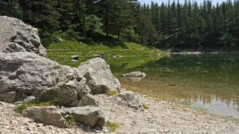 Crystal-clear mountain lake, spring, cinematic slider motion, 4K 動画素材 320154987