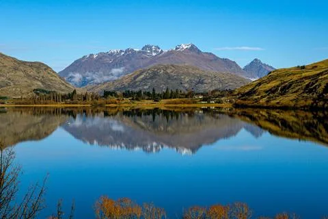 Crystal Clear Mountain Reflection in Still Lake, Queenstown NZ Stock Photos