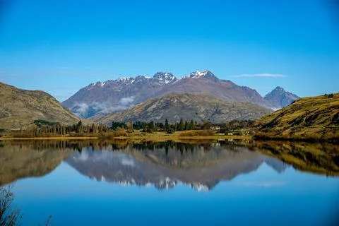 Crystal Clear Mountain Reflection in Still Lake, Queenstown NZ Stock Photos