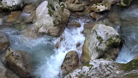 Crystal Clear Mountain Stream Cascading Over Boulders in Tolmin Gorges, Slovenia Stockbeeldmateriaal 344861181