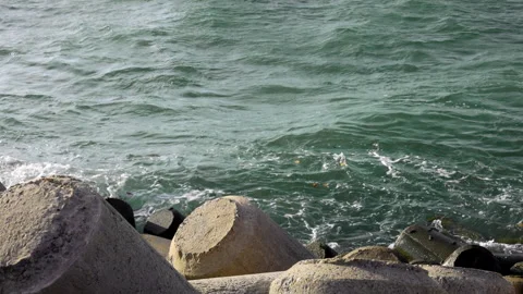 Crystal-clear ocean waves gently roll toward the shore in smooth slow motion. Stock Footage 340952494