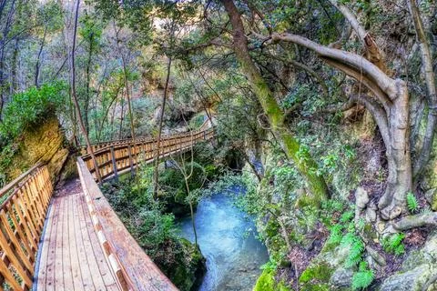 Crystal clear river running through a pristine valley in the town of Pioraco wit 写真素材