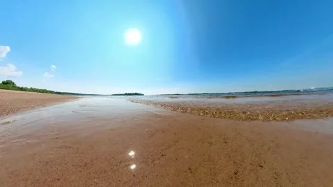 Crystal clear river tidal waves on the sandy beach. Meditative and calm, sunny Stock Footage 255972494
