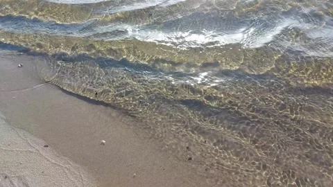 Crystal clear river tidal waves on the sandy beach Stock Footage 258915721