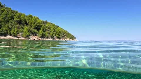 Crystal clear sea water splits the frame near Korcula island in Croatia Video stock 341675680