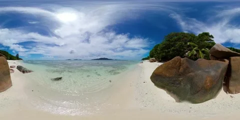 Crystal-clear shallow waters and smooth boulders. La Digue, Seychelles. Stock Footage 301446541