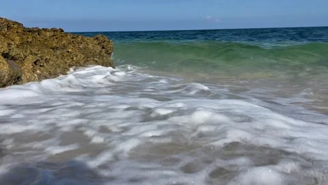 Crystal Clear Shore Waves Beside Coastal Rocks Stock Footage 334986187