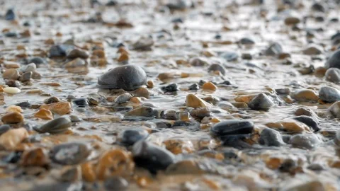 Crystal clear stream flows over the pebbles. Close up Video stock 108965436