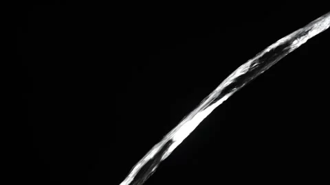 Crystal clear stream of water flowing on isolated black background, close up Stock Footage 305894262