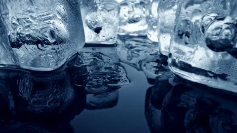 Crystal clear transparent ice cubes shining with light. Ice melting and is 스톡 동영상 131671255