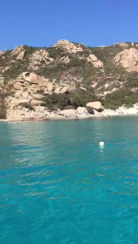 Crystal Clear Turquoise Sea and Rocky Coast in Sardinia Stock Footage 327870448