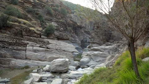 Crystal clear water between old stones, natural valley in spring. Stock Footage 99868327