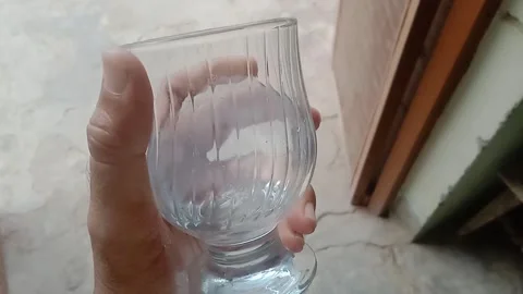 Crystal Clear Water Filling a Simple Glass in a Refreshing Close Up Stock Footage 346428091