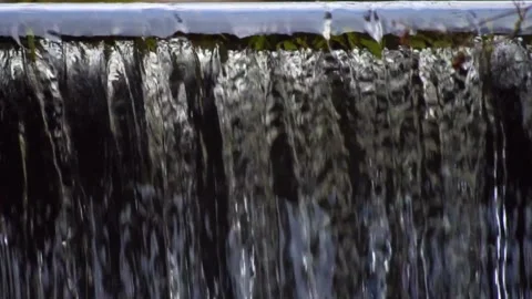 Crystal clear water flowing down a waterfall Video stock 146801164