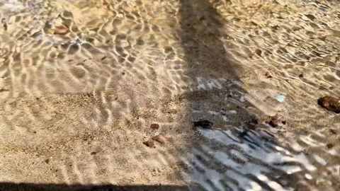 Crystal Clear Water Flowing Over Natural Sandy Bed Video stock 337675808
