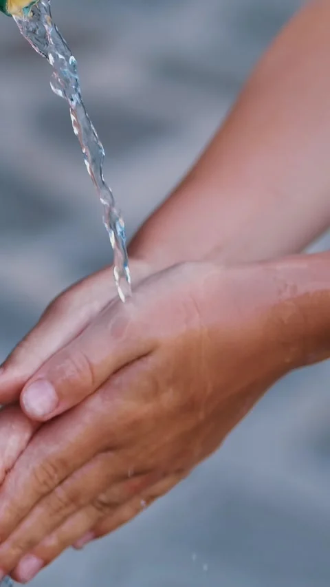 Crystal clear water flows from an old Public Iron Fountain , a well, kid girl Stock-Footage 317702354