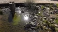 Crystal clear water with rocks and bridge tilt up landscape Mértola Prt 4k or 4k+ Resolution