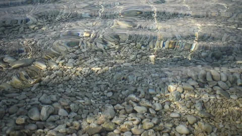 Crystal clear water. Salt, clear water, rocks and light waves Stock Footage 114757237