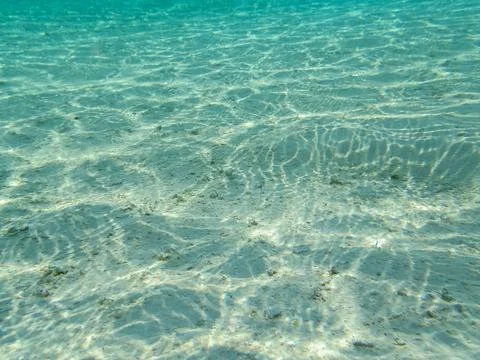 Crystal Clear Water Sunlight Patterns Stock Photos
