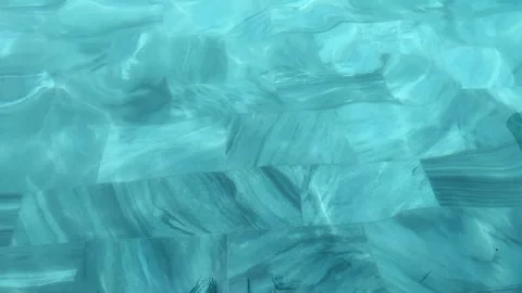 A Crystal Clear Water Surface Showcasing Beautifully Abstract Patterns and Stock Footage 346049148