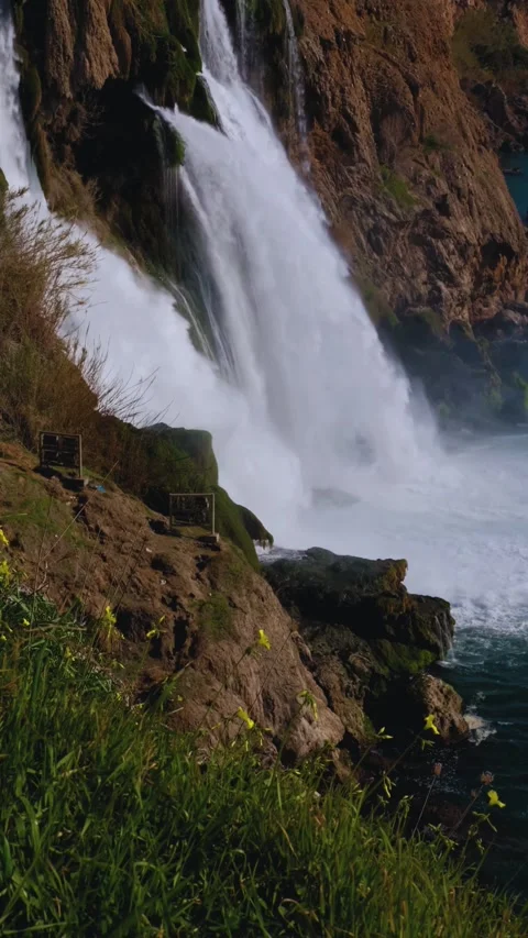 Crystal Clear Waterfall Flowing Over Smooth River Rocks 4K Stock Footage 314540422