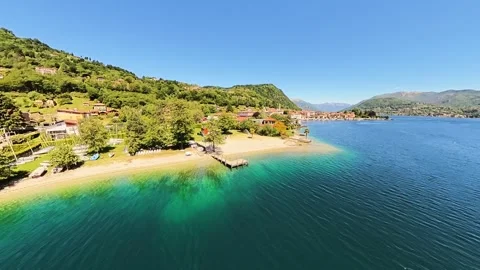 Crystal Clear Waters and Lakeside Beach on a Sunny Summer Day Video stock 335879408