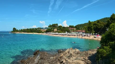 Crystal-clear waters lap against rocky shores. Lagomandra, Greece Video stock 339022031