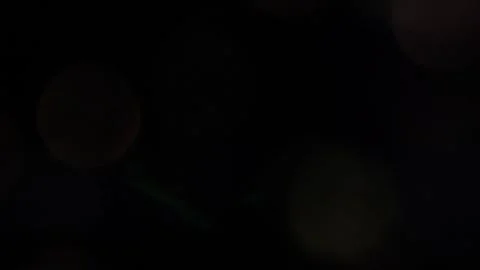 Crystal colored bokeh lights shining in the dark 스톡 동영상 318361580