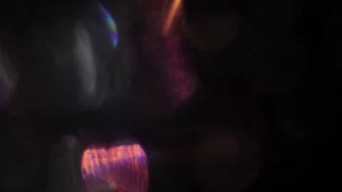 Crystal colored lights on the left in the blackness Video stock 318665527