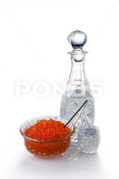 Crystal Decanter with vodka and capacity with red caviar.. Stock Photos