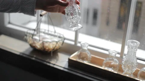 Crystal Dishes on the Windowsill Stock Footage 65417079
