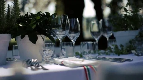 Crystal glasses stand on white table Stock Footage 69168254