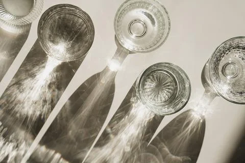 Crystal Glassware Casting Dynamic Shadows, Simple Neutral Background Fotos de archivo
