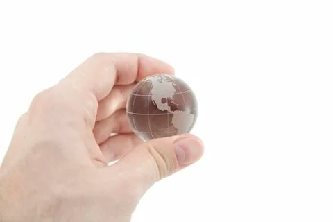Crystal globe in hand with clipping path Stock-Fotos