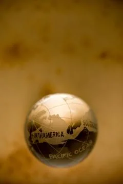 Crystal globe on old paper Stock Photos