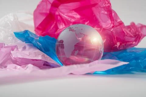 The crystal globe on plastic bag. Plastic waste overflows the world. Global W Stock Photos